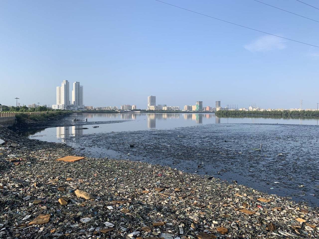 Flooded coastal homes in Karachi after sea intrusion.