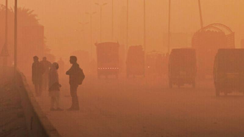 Thick smog blanketing Lahore skyline with masked residents, AQI gauge at 300