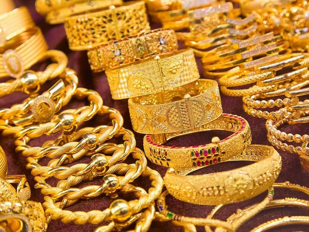 Close-up of gold jewellery bangles on display